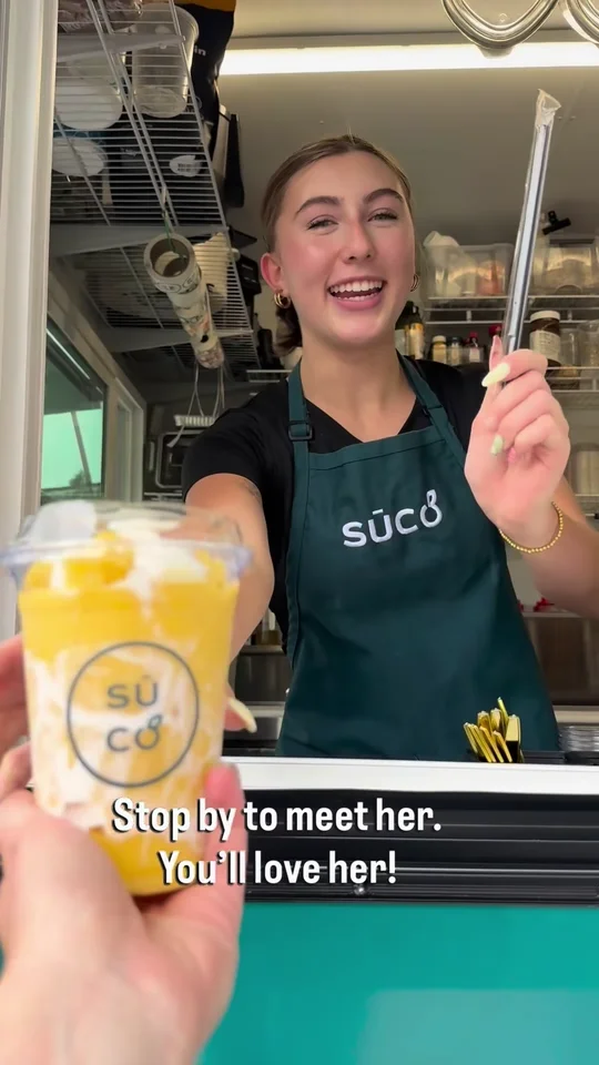 A Sinaloa Sunset smoothie handed over at the food truck window.