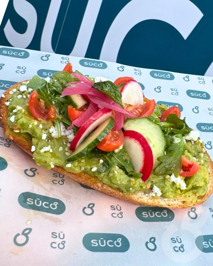 A closer look at our Signature Avocado Toast and its colorful toppings.